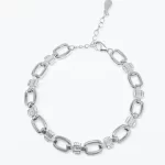 масивна дамска сребърна гривна проба 925 с овални елементи и бляскави камъни